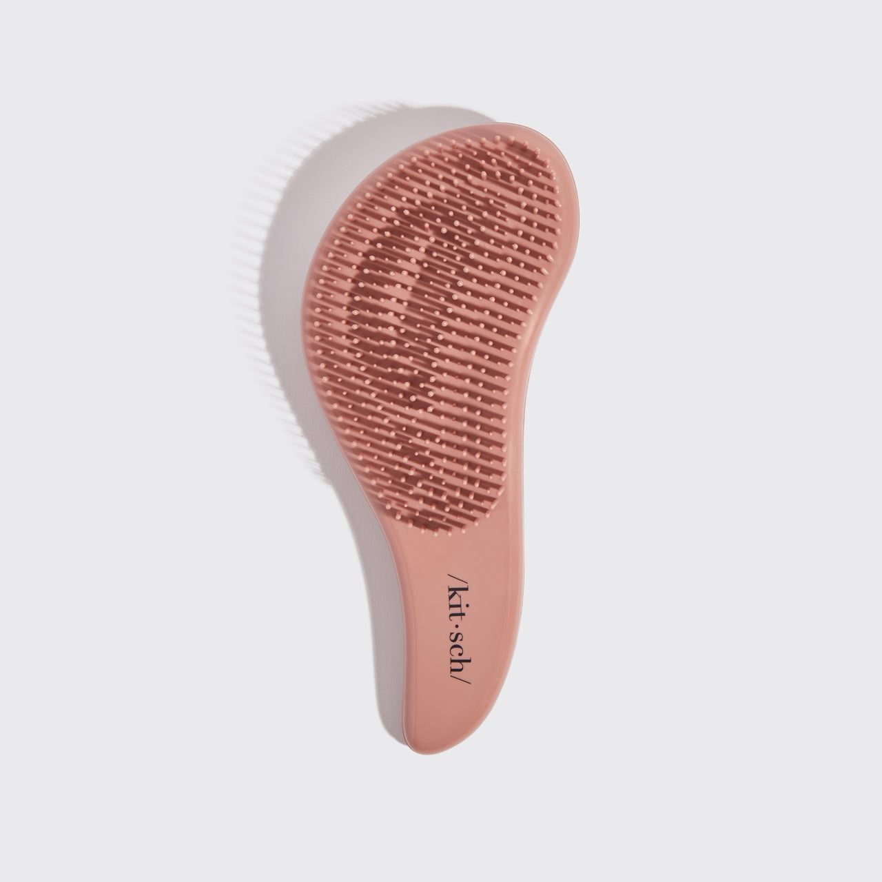 Kitsch Terracotta Detangling Brush angled view showing bristle base